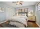 Comfortable bedroom featuring hardwood floors, a ceiling fan, and great natural lighting at 2711 Winding Ne Ln, Brookhaven, GA 30319