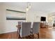 Dining area featuring a modern table set, hardwood flooring, and contemporary lighting at 2711 Winding Ne Ln, Brookhaven, GA 30319