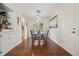 Bright dining room with hardwood floors and modern light fixture at 2711 Winding Ne Ln, Brookhaven, GA 30319