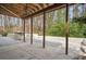 Covered patio with wood beam supports and backyard view at 2711 Winding Ne Ln, Brookhaven, GA 30319