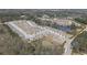 Aerial view of new construction community with many homes surrounding a pond at 2917 Knob Creek Dr, Snellville, GA 30078