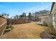 Large backyard with lawn, complemented by a white picket fence and a covered porch, perfect for outdoor relaxation at 2917 Knob Creek Dr, Snellville, GA 30078