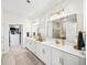 Elegant bathroom with dual sinks, white cabinetry, and modern fixtures at 2917 Knob Creek Dr, Snellville, GA 30078