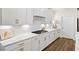 Close-up of a kitchen featuring white cabinets, subway tile backsplash, and a gas cooktop at 2917 Knob Creek Dr, Snellville, GA 30078