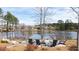 Pond featuring chairs around a table and firepit, surrounded by lush greenery at 2917 Knob Creek Dr, Snellville, GA 30078