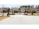 Gated street view of single Gathering homes in the Saddle Brook Community by Century Communities at 2917 Knob Creek Dr, Snellville, GA 30078