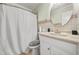 Bathroom with shower-tub combination, white vanity and cabinet at 6105 Queen Anne Ct, Norcross, GA 30093