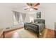 Comfortable bedroom with a ceiling fan and natural light at 6105 Queen Anne Ct, Norcross, GA 30093