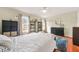 Bedroom featuring natural light, wood floors, and a dark wood dresser at 6105 Queen Anne Ct, Norcross, GA 30093