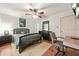 Bedroom features fan, warm lighting, natural wood floors, and a comfortable decor at 6105 Queen Anne Ct, Norcross, GA 30093