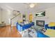 Living room with fireplace, hardwood floors, and plenty of natural light at 6105 Queen Anne Ct, Norcross, GA 30093