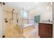 Bathroom featuring tiled shower, soaking tub and vanity at 31 Greenland Trce, Atlanta, GA 30342