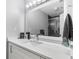 Bright bathroom featuring a modern vanity, sleek faucet, and a stylish glass-enclosed shower for a luxurious experience at 31 Greenland Trce, Atlanta, GA 30342