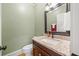 Powder room with granite countertop and modern fixtures at 31 Greenland Trce, Atlanta, GA 30342