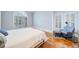 Charming bedroom features hardwood floors, seating area, and large arched window at 31 Greenland Trce, Atlanta, GA 30342