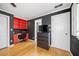 Bedroom boasting hardwood floors, built-in shelving and desk, offering a cozy and functional living space at 31 Greenland Trce, Atlanta, GA 30342