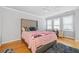 This bedroom has a large window letting in natural light, and a view of the built-in desk area at 31 Greenland Trce, Atlanta, GA 30342