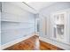 Walk-in closet with custom shelving and natural light from multiple windows at 31 Greenland Trce, Atlanta, GA 30342