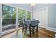 Dining area features a table and chairs with large windows overlooking the deck at 31 Greenland Trce, Atlanta, GA 30342