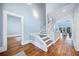 Spacious foyer with hardwood floors and an open staircase at 31 Greenland Trce, Atlanta, GA 30342