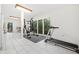 Spacious home gym with a treadmill, punching bag, and plenty of natural light at 31 Greenland Trce, Atlanta, GA 30342