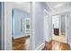 Hallway with hardwood floors provides access to a bedroom and bathroom at 31 Greenland Trce, Atlanta, GA 30342