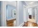 Hallway featuring hardwood floors leading to a bedroom and a bathroom at 31 Greenland Trce, Atlanta, GA 30342