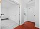 Hallway leading to rooms with white and red tile flooring at 31 Greenland Trce, Atlanta, GA 30342