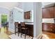 Kitchen features breakfast bar seating, granite countertops and dark wood cabinets at 31 Greenland Trce, Atlanta, GA 30342