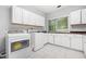 Well-equipped laundry room with lots of storage and sleek appliances at 31 Greenland Trce, Atlanta, GA 30342