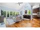 Spacious living area with vaulted ceilings, hardwood floors, and a seamless flow into an open kitchen at 31 Greenland Trce, Atlanta, GA 30342
