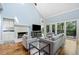 Open concept living room with vaulted ceilings, fireplace, and hardwood flooring at 31 Greenland Trce, Atlanta, GA 30342