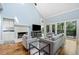 Bright living room with hardwood floors, fireplace, and views of the trees at 31 Greenland Trce, Atlanta, GA 30342