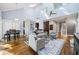 Open-concept living room with high ceilings, fireplace, and plenty of natural light at 31 Greenland Trce, Atlanta, GA 30342