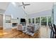 Open concept living room with vaulted ceilings, fireplace and glass doors to a deck at 31 Greenland Trce, Atlanta, GA 30342