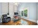 Bright office space with built-in bookshelves, a large window, and hardwood floors at 31 Greenland Trce, Atlanta, GA 30342