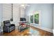 Bright office space featuring custom built-ins, hardwood floors, and a large window providing natural light at 31 Greenland Trce, Atlanta, GA 30342