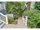 Pathway with stone steps leads through lush greenery; a whimsical touch with a 'love' sign adds charm at 31 Greenland Trce, Atlanta, GA 30342