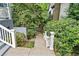 Landscaped walkway leading to the home, surrounded by greenery at 31 Greenland Trce, Atlanta, GA 30342