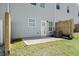Backyard patio space with partial grass area, AC unit, and wooden fence at 315 Skye Ln # 50, Cartersville, GA 30121