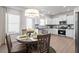 Well-lit dining area featuring a modern light fixture and access to the kitchen at 315 Skye Ln # 50, Cartersville, GA 30121