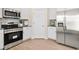 Bright kitchen features stainless steel appliances, white cabinetry, and hard surface countertops at 315 Skye Ln # 50, Cartersville, GA 30121