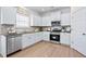 Modern kitchen with stainless steel appliances and white cabinetry at 315 Skye Ln # 50, Cartersville, GA 30121