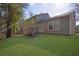 Large backyard with a manicured grassy lawn at 5338 Timor Trl, Lithonia, GA 30038