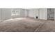 Basement area features carpet flooring and natural light from windows at 5338 Timor Trl, Lithonia, GA 30038