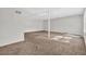 Basement area features carpet flooring, and natural light from windows at 5338 Timor Trl, Lithonia, GA 30038