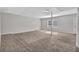 Spacious basement area with carpet flooring and natural light from windows at 5338 Timor Trl, Lithonia, GA 30038