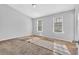 Bright bedroom with light gray walls and two windows at 5338 Timor Trl, Lithonia, GA 30038