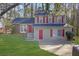 Charming two-story home with red shutters, well-manicured lawn, and inviting curb appeal at 5338 Timor Trl, Lithonia, GA 30038