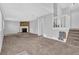 A living room with a brick fireplace and carpet floors at 5338 Timor Trl, Lithonia, GA 30038
